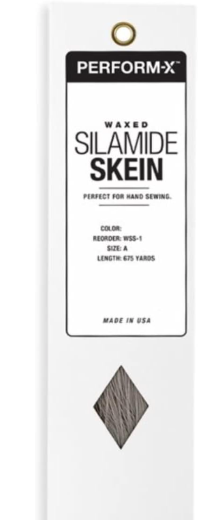 White Box with key hole window to view Grey thread