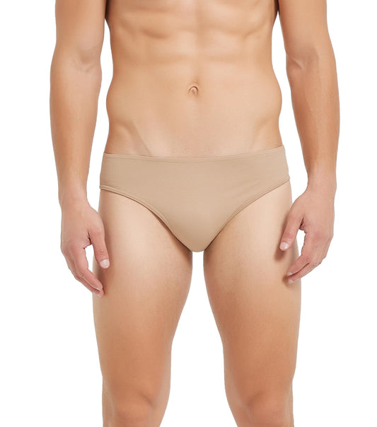 Beige underwear worn by a person on a white background
