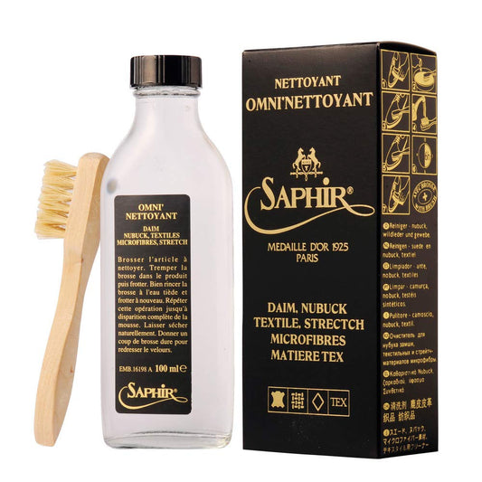 Saphir cleaning solution bottle with brush and packaging on a white background